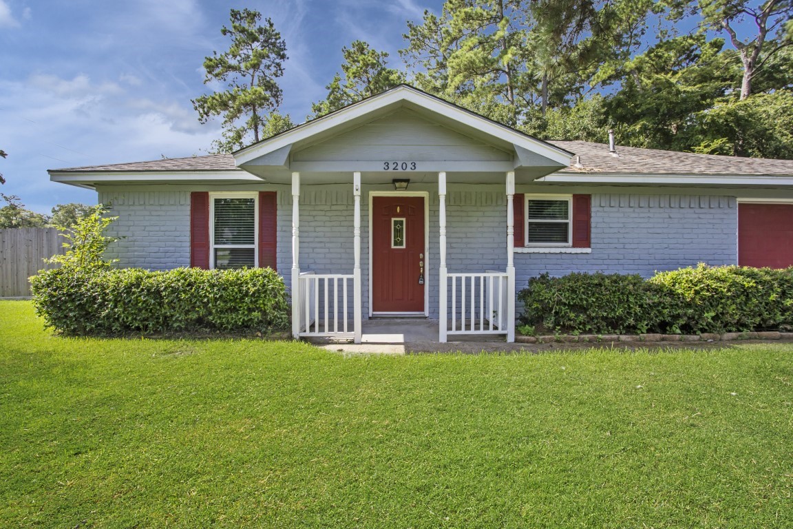 3203 Willie Way Spring, TX 77380 - Photo 2 of 31 a front view of a house with garden