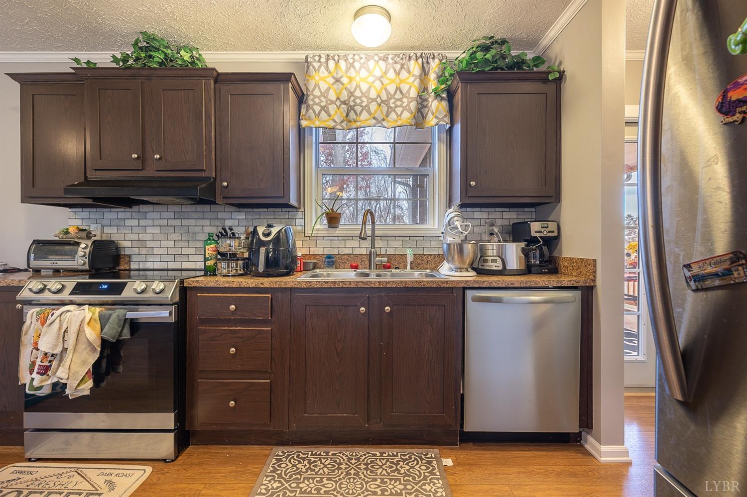 1736 Timber Ridge Road Bedford, VA 24523 - Photo 14 of 29 a kitchen with a refrigerator and a stove