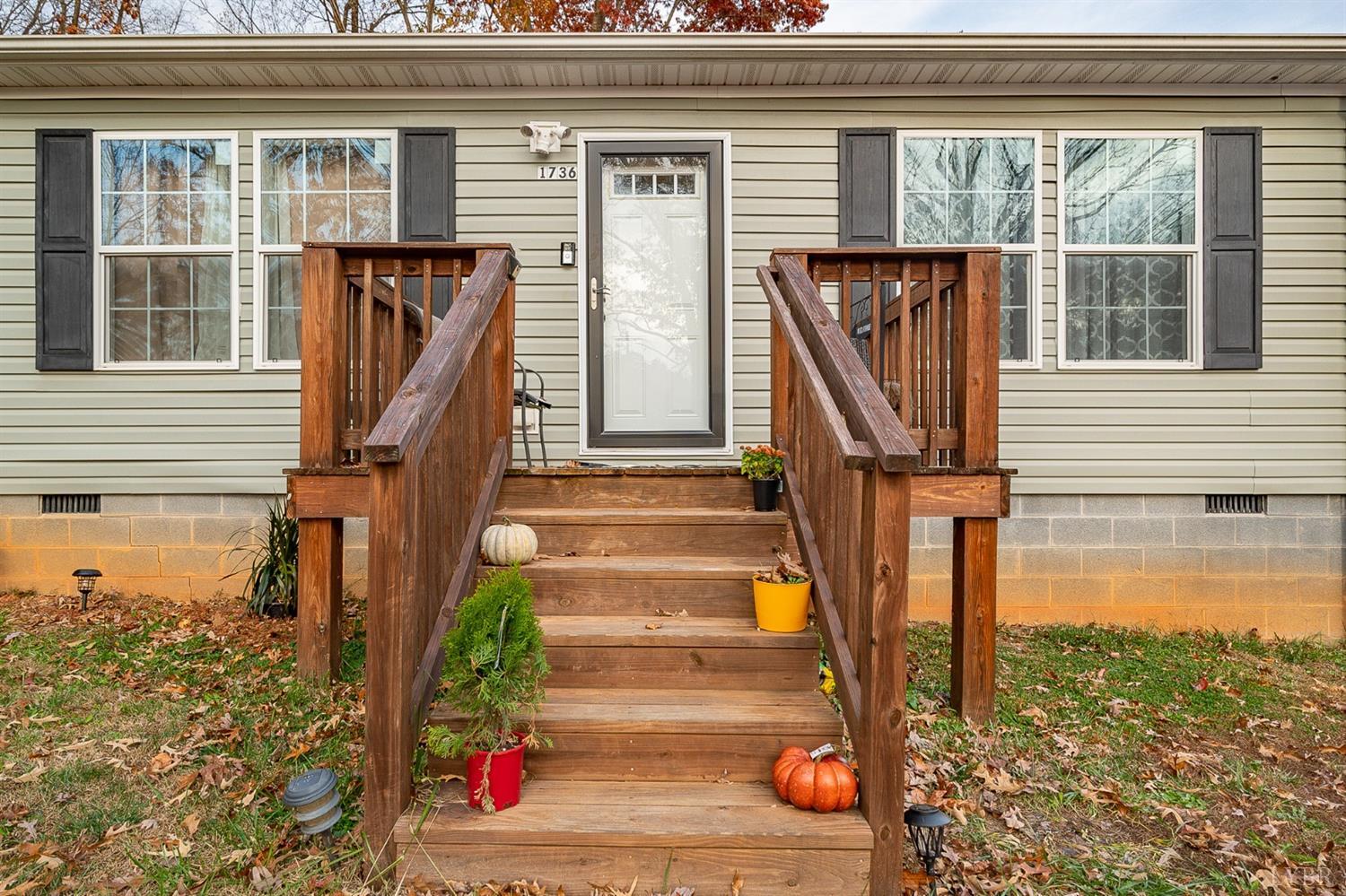 1736 Timber Ridge Road Bedford, VA 24523 - Photo 5 of 29 a front view of a house with a yard