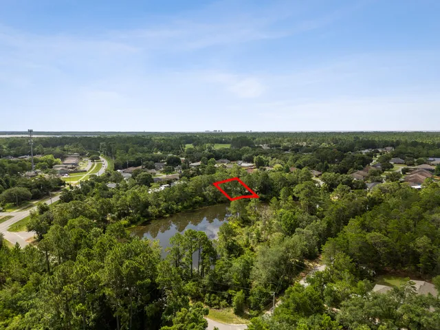an aerial view of residential houses with city view and lake view