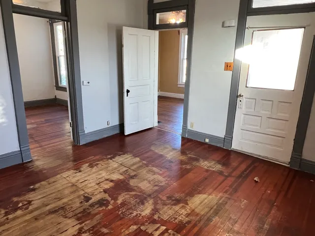 a view of an empty room with a window