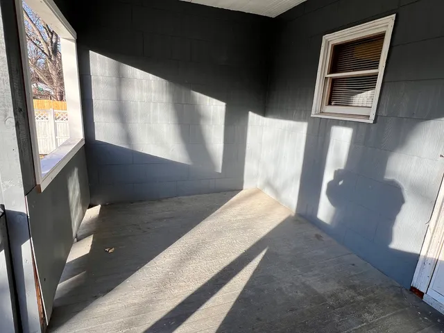 a view of living room with furniture and window