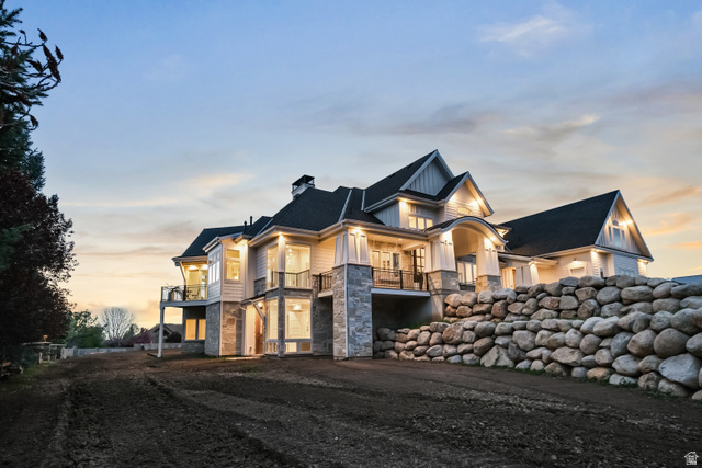 1354 South 800 East Mapleton, UT 84664 - Photo 4 of 129 View of front of home featuring stone siding, a chimney, and a balcony