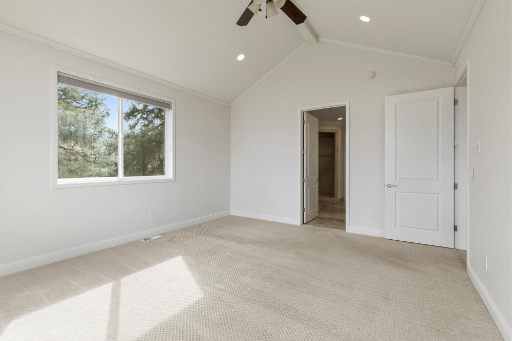 6586 Cooper's Hawk Road Klamath Falls, OR 97601 - Photo 22 of 68 an empty room with windows and fan