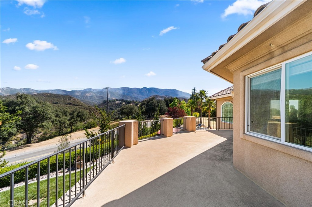 38136 Butterfly Court Yucaipa, CA 92399 - Photo 52 of 71 a balcony with outdoor seating and city view