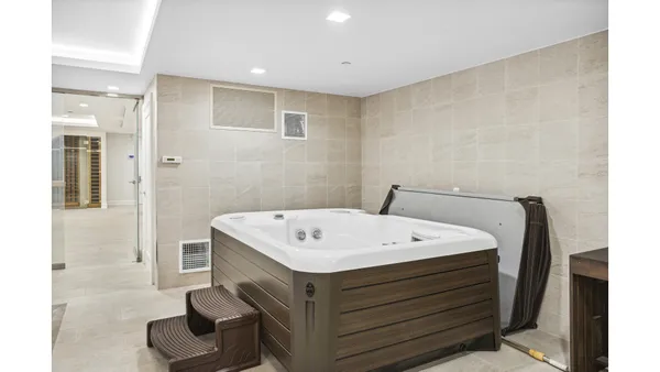 a kitchen with a sink and white cabinets