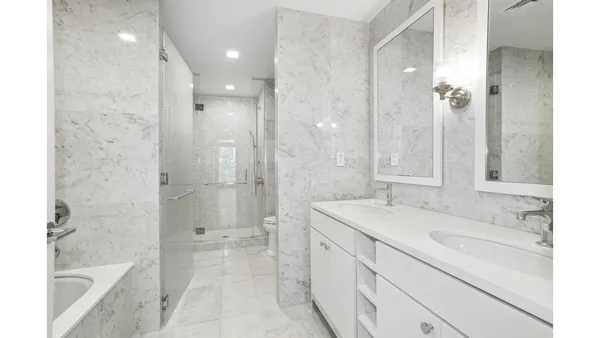 a view of a kitchen cabinets and a wooden floor