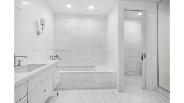 a bed room with a bed and a window