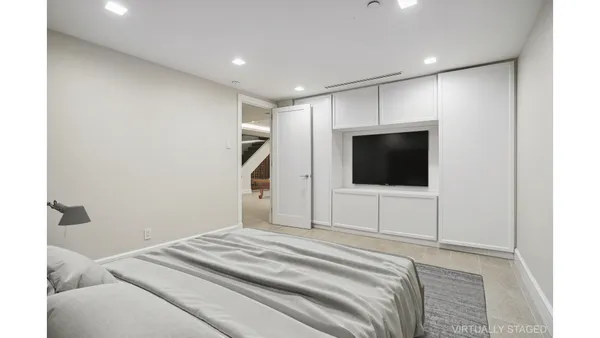 a bathroom with a double vanity sink and a mirror
