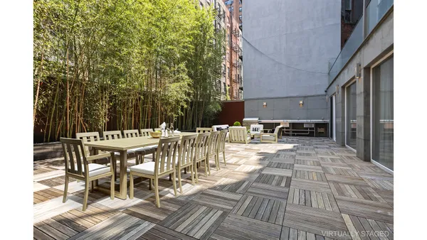 a bathroom with a bathtub shower sink vanity and toilet