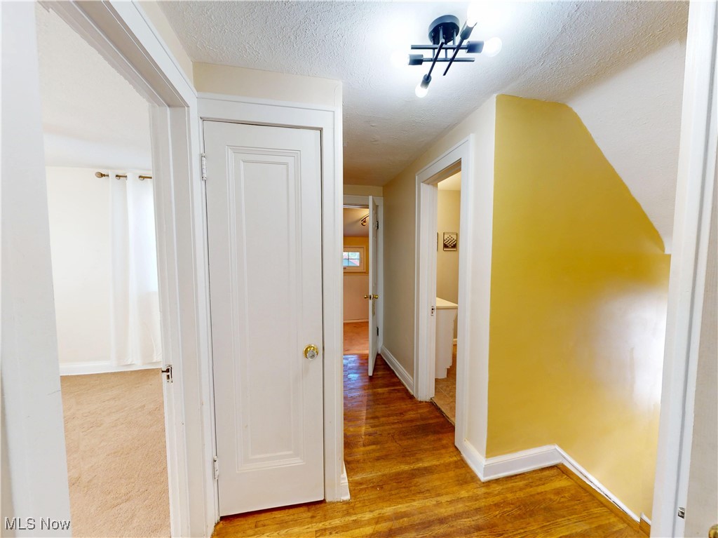 1136 Erieview Road Cleveland Heights, OH 44121 - Photo 32 of 45 Corridor featuring wood finished floors and a textured ceiling