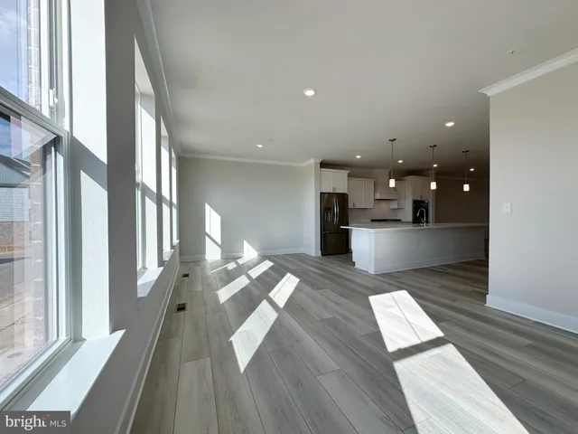a view of a kitchen with a sink and cabinets