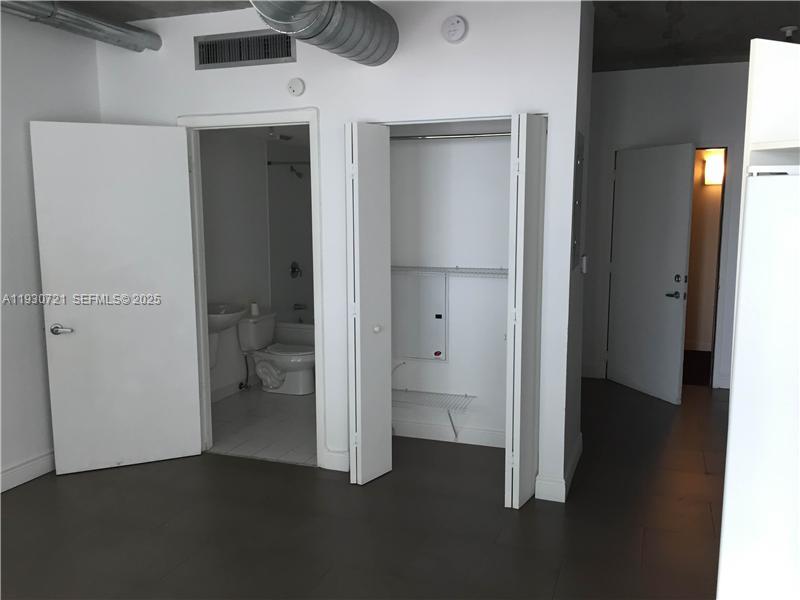 690 Southwest 1st Court, Unit 1727 Miami, FL 33130 - Photo 5 of 15 a view of a hallway with a room