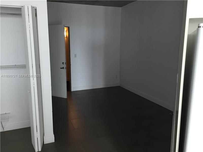 690 Southwest 1st Court, Unit 1727 Miami, FL 33130 - Photo 6 of 15 a view of small space with wooden floor