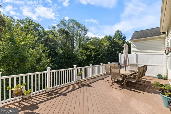 a view of a patio with a table and chairs