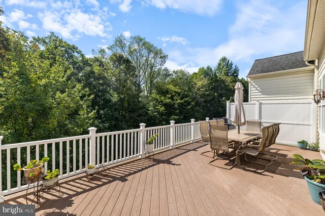 a view of a patio with a table and chairs