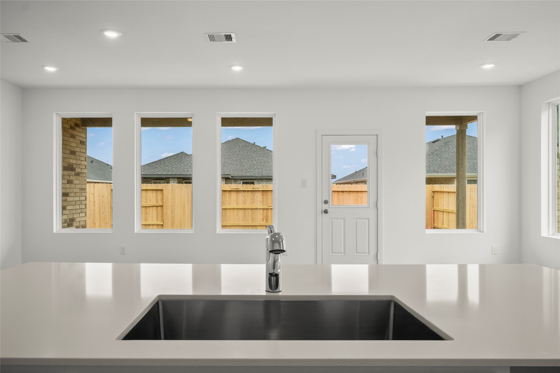 1935 Stargazer Lane Angleton, TX 77515 - Photo 1 of 17 a view of a kitchen with a sink dishwasher and a large window