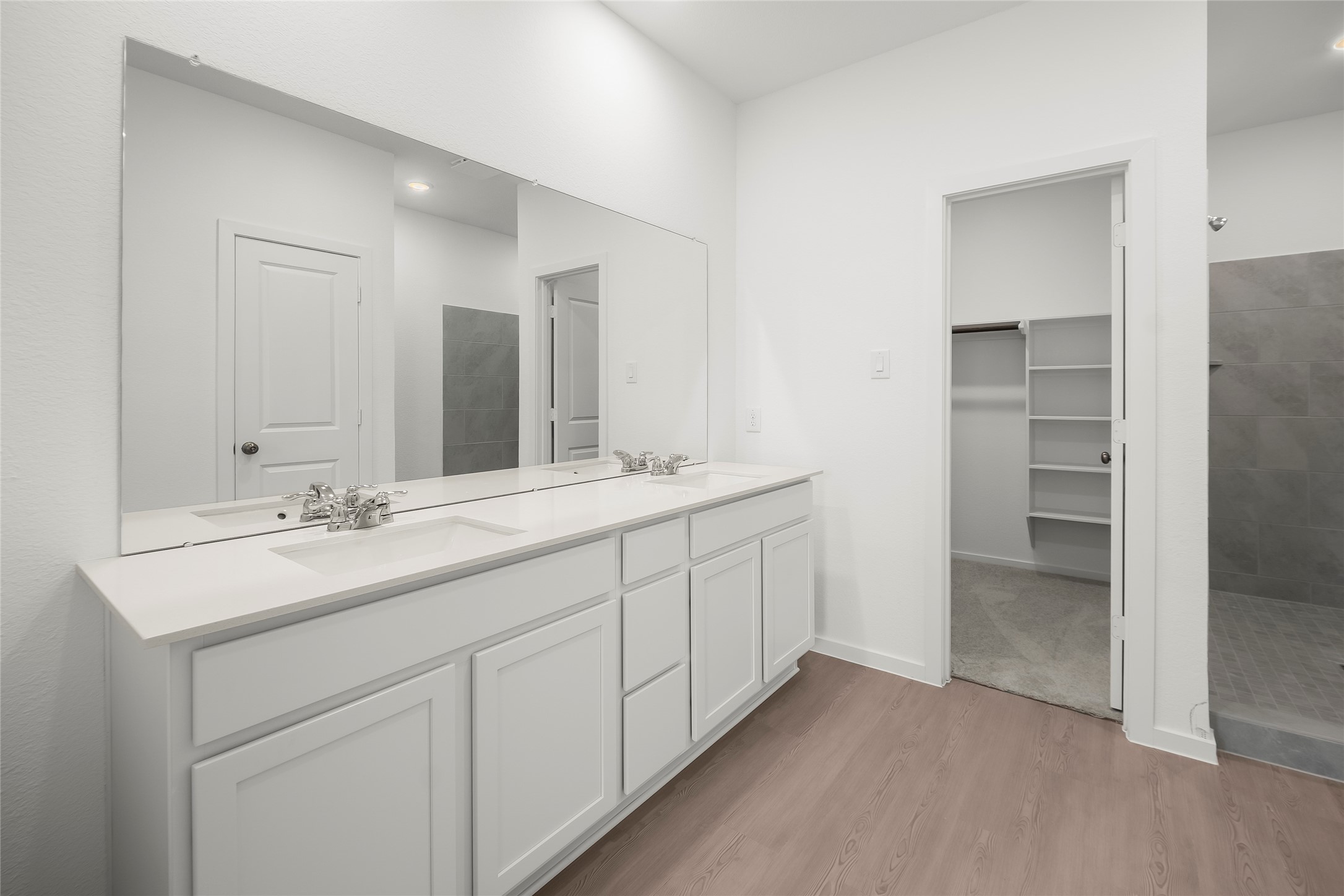 1935 Stargazer Lane Angleton, TX 77515 - Photo 8 of 17 a bathroom with a double vanity sink and mirror