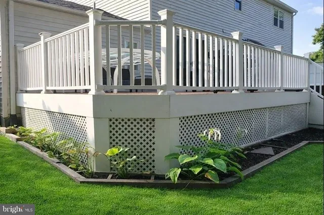 a view of a wooden deck with furniture