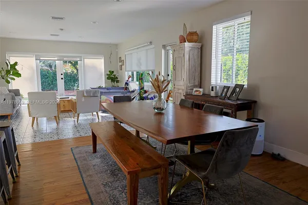 a view of a dining room with furniture and window