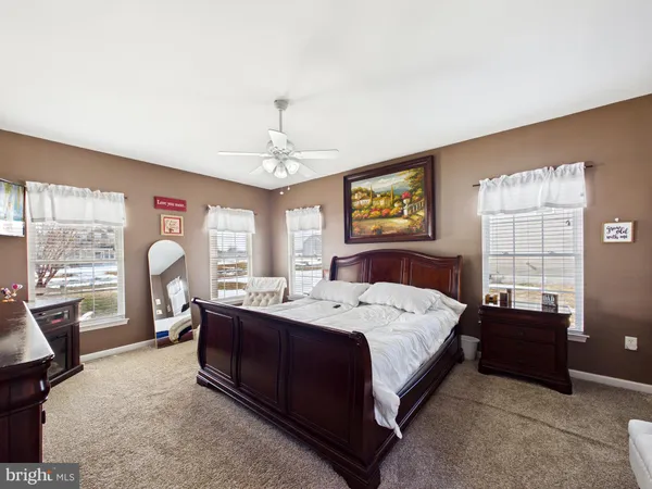 a bed room with a bed and a chandelier