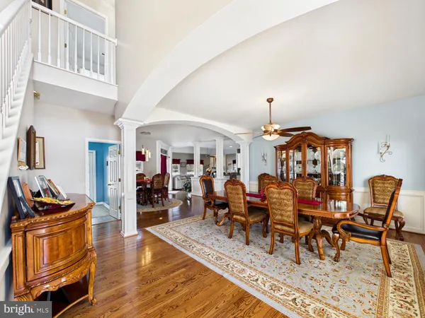 a living room with furniture a rug and a chandelier