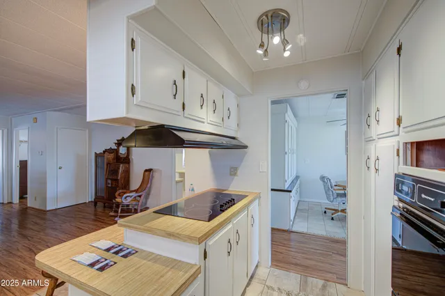 a kitchen that has a cabinets and a stove