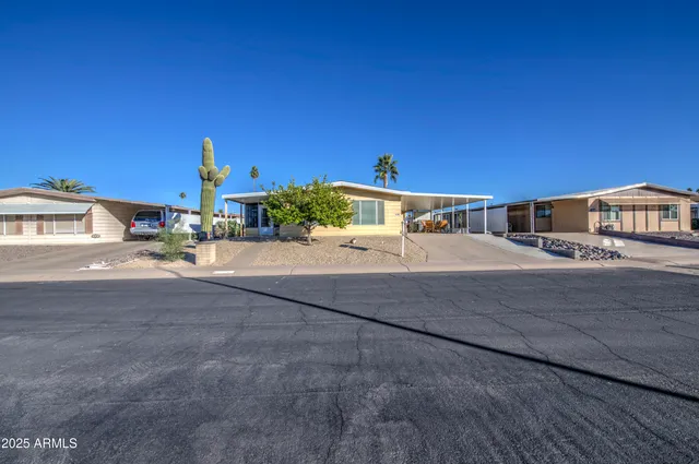a view of a house with a street from a balcony