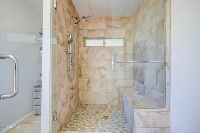 a bathroom with a shower and a sink
