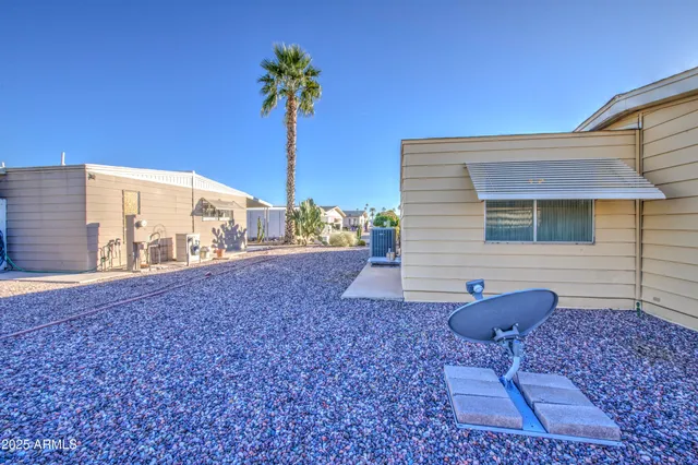 a view of backyard with a table and chairs