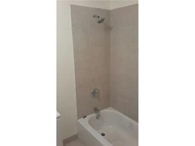 a bathroom with a white tub