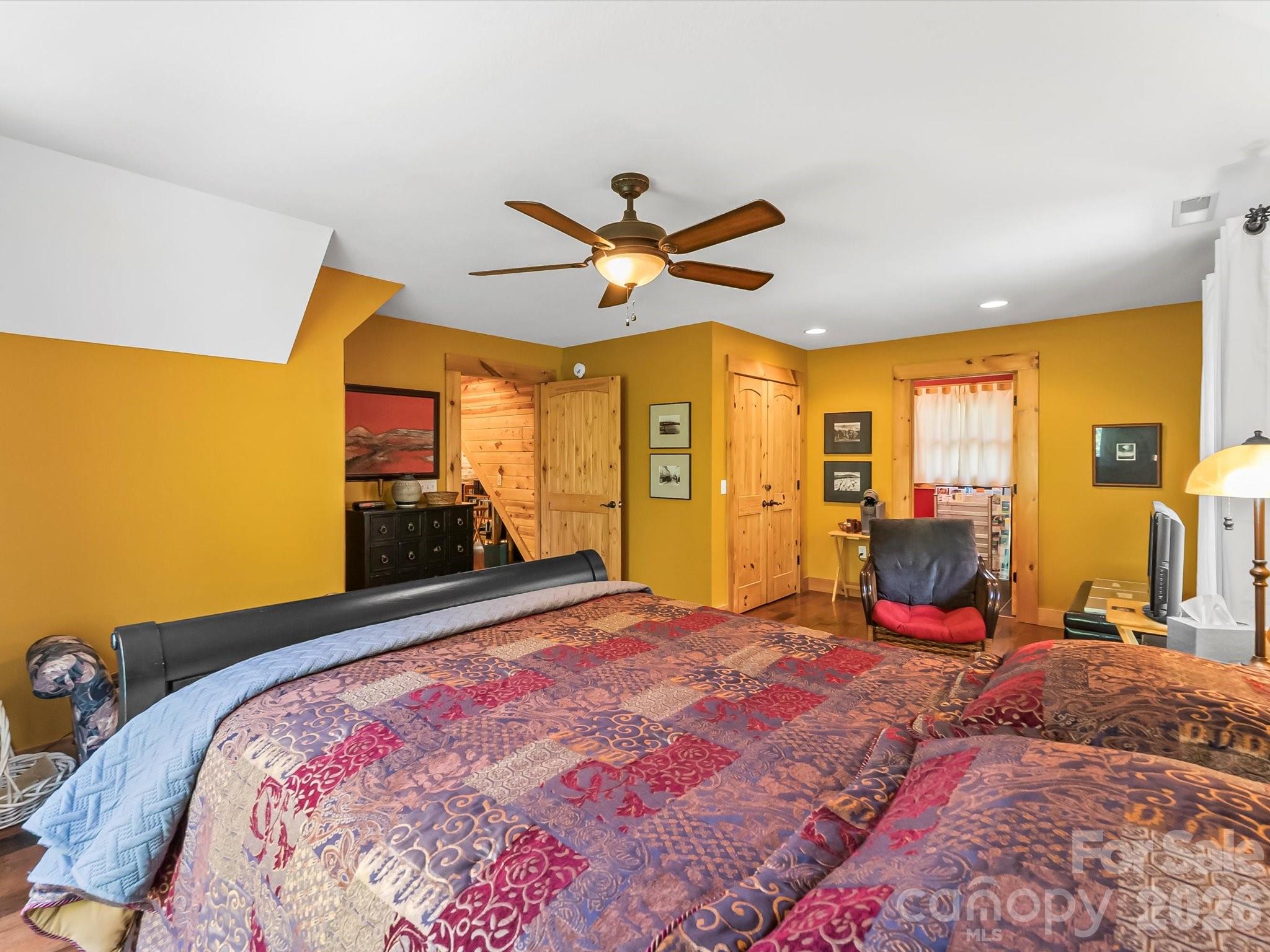 917 Otter Mountain Road Topton, NC 28781 - Photo 41 of 48 a bedroom with a bed and large windows