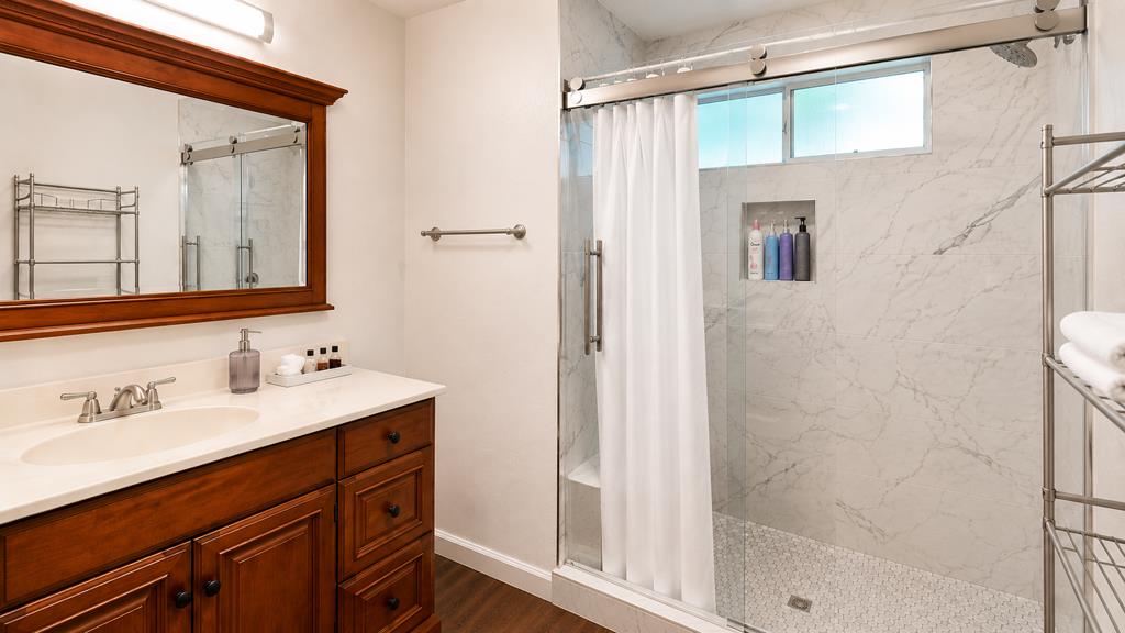 1281 Traynor Road Concord, CA 94520 - Photo 25 of 41 a bathroom with a sink a mirror and a shower