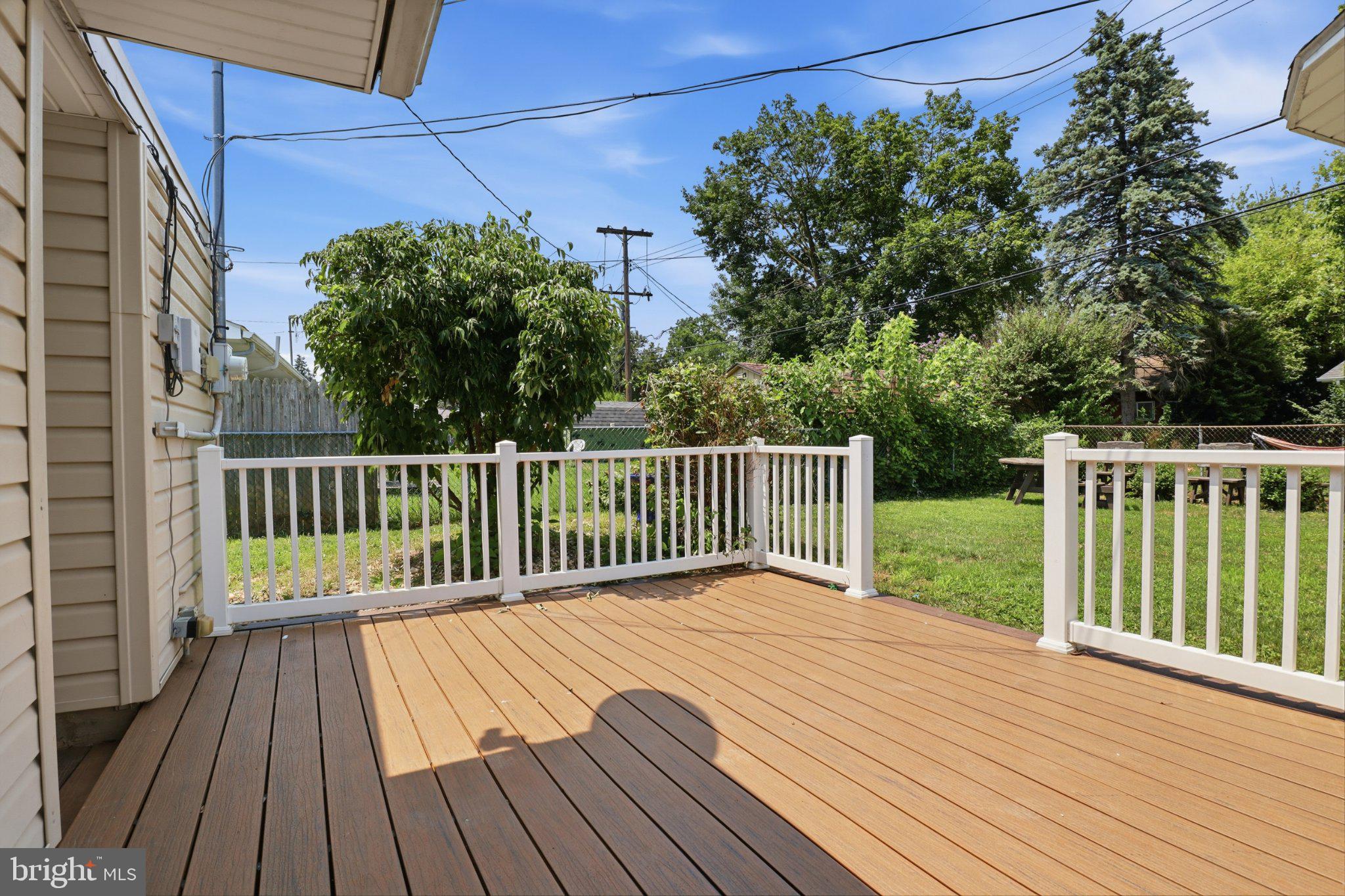 807 Fireside Road York, PA 17404 - Photo 14 of 31 Sunny deck with lush greenery views.