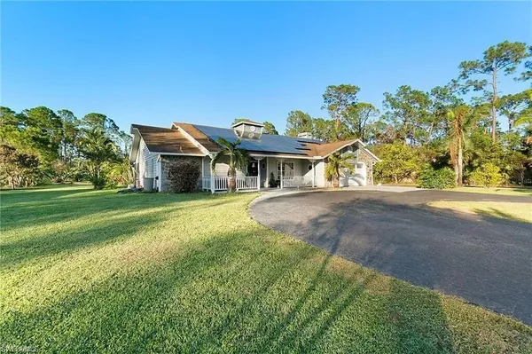 a view of a house with a big yard