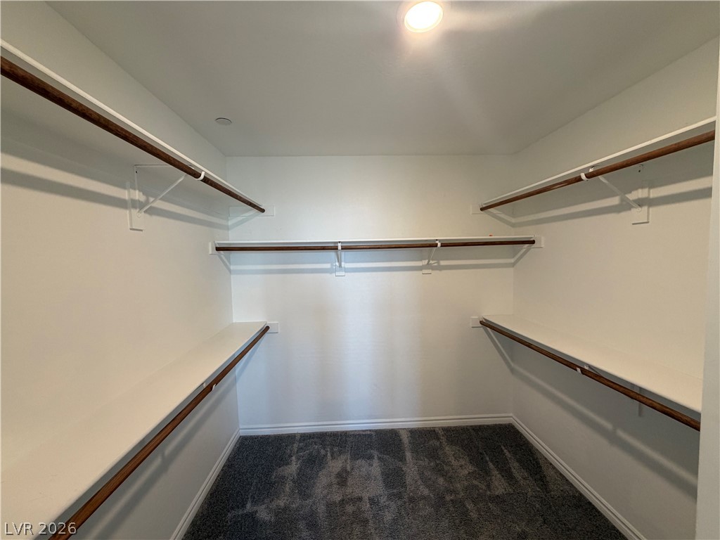 3228 Azalea Ridge Court Henderson, NV 89052 - Photo 12 of 28 A well-lit closet with ample shelving and hanging space awaits your wardrobe.