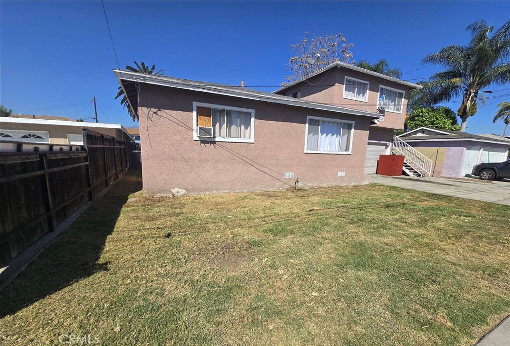 9813 Cortada Street El Monte, CA 91733 - Photo 4 of 7 a front view of a house with a yard