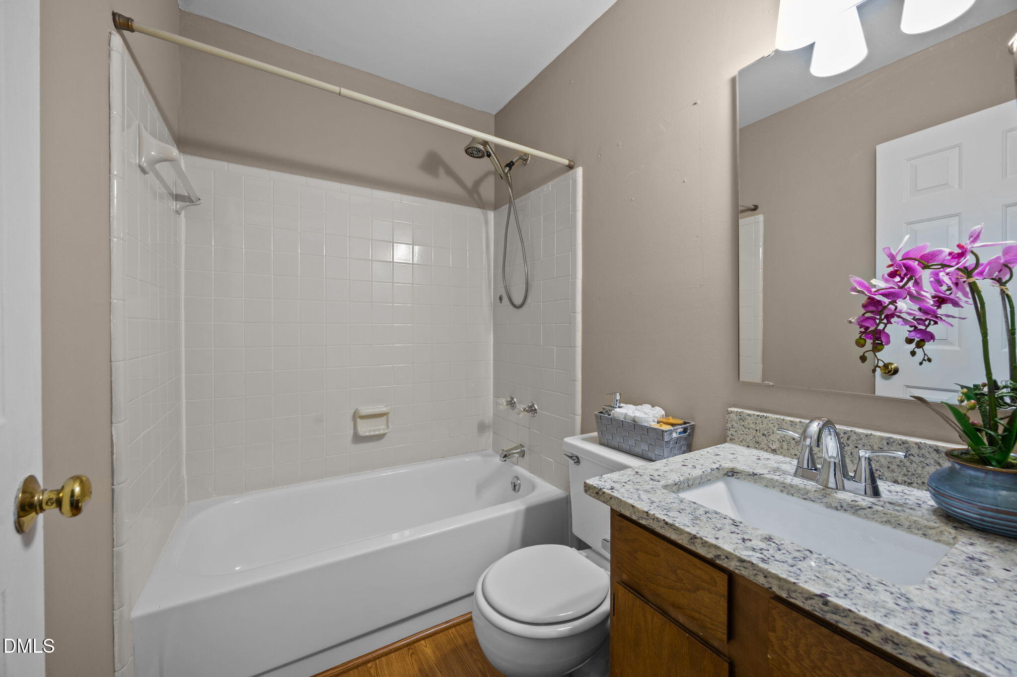 1524 Township Circle Raleigh, NC 27609 - Photo 15 of 30 a bathroom with a granite countertop sink a toilet and shower