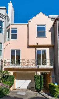 a front view of a house with large windows