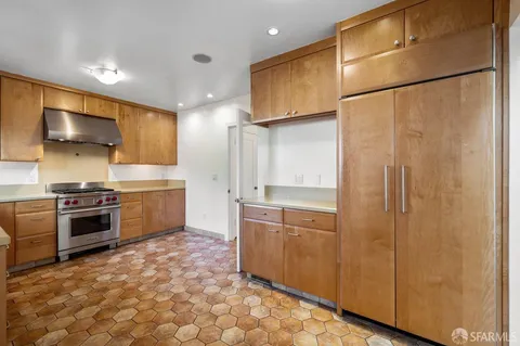 a kitchen with a stove and a sink
