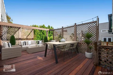 a view of a tennis court with wooden floor