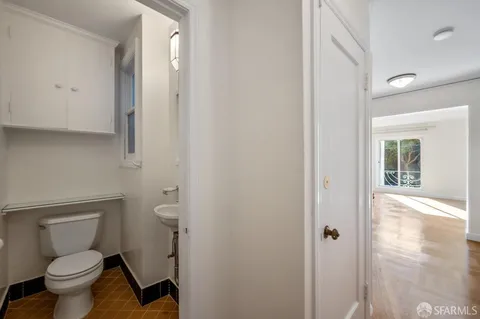 a kitchen with a refrigerator and a sink