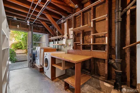 a view of an empty room with furniture