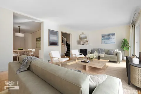 a living room with furniture and a large mirror