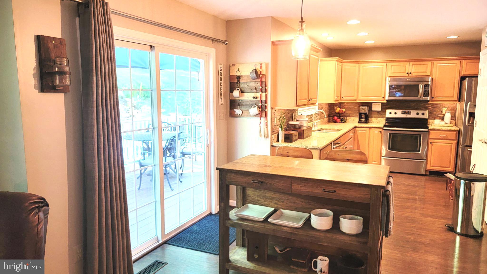 3041 Conowingo Road Street, MD 21154 - Photo 25 of 47 Breakfast Bar , Back Slider into Kitchen