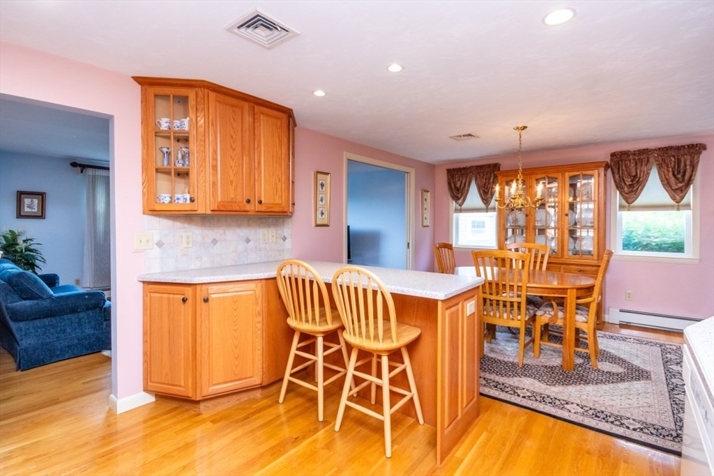 35 Gardiner Road Quincy, MA 02169 - Photo 12 of 35 a view of a kitchen with a dining table chairs and window