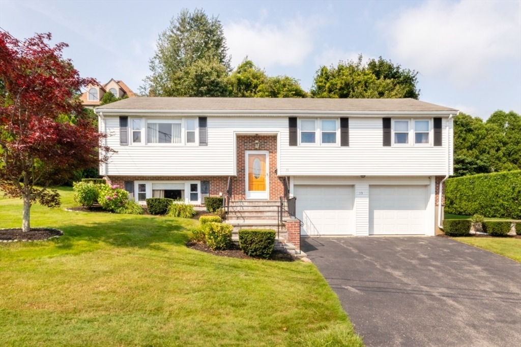 35 Gardiner Road Quincy, MA 02169 - Photo 2 of 35 a front view of a house with a yard and garage