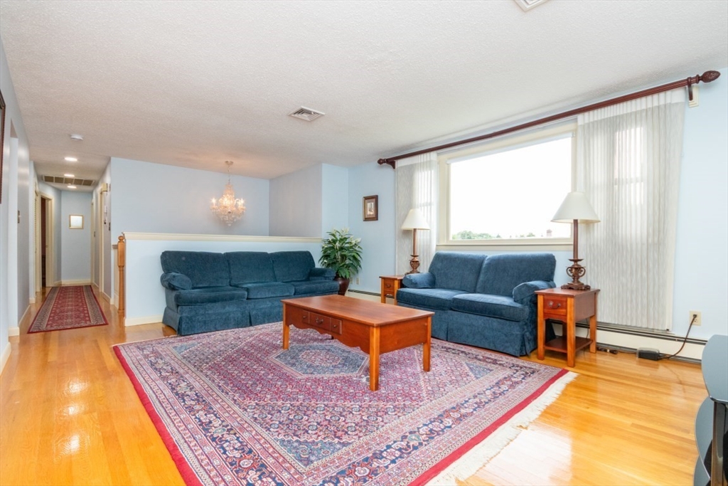 35 Gardiner Road Quincy, MA 02169 - Photo 7 of 35 a living room with furniture and a rug