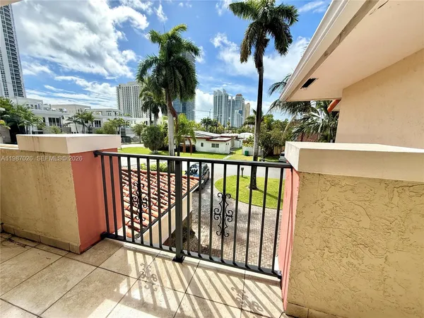 a view of balcony with a potted plant