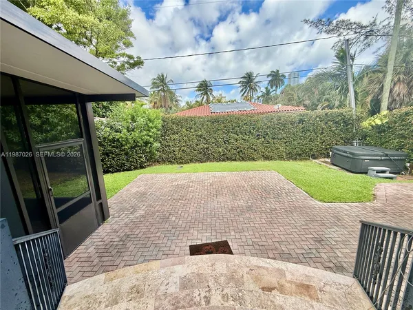 a view of a backyard with a garden